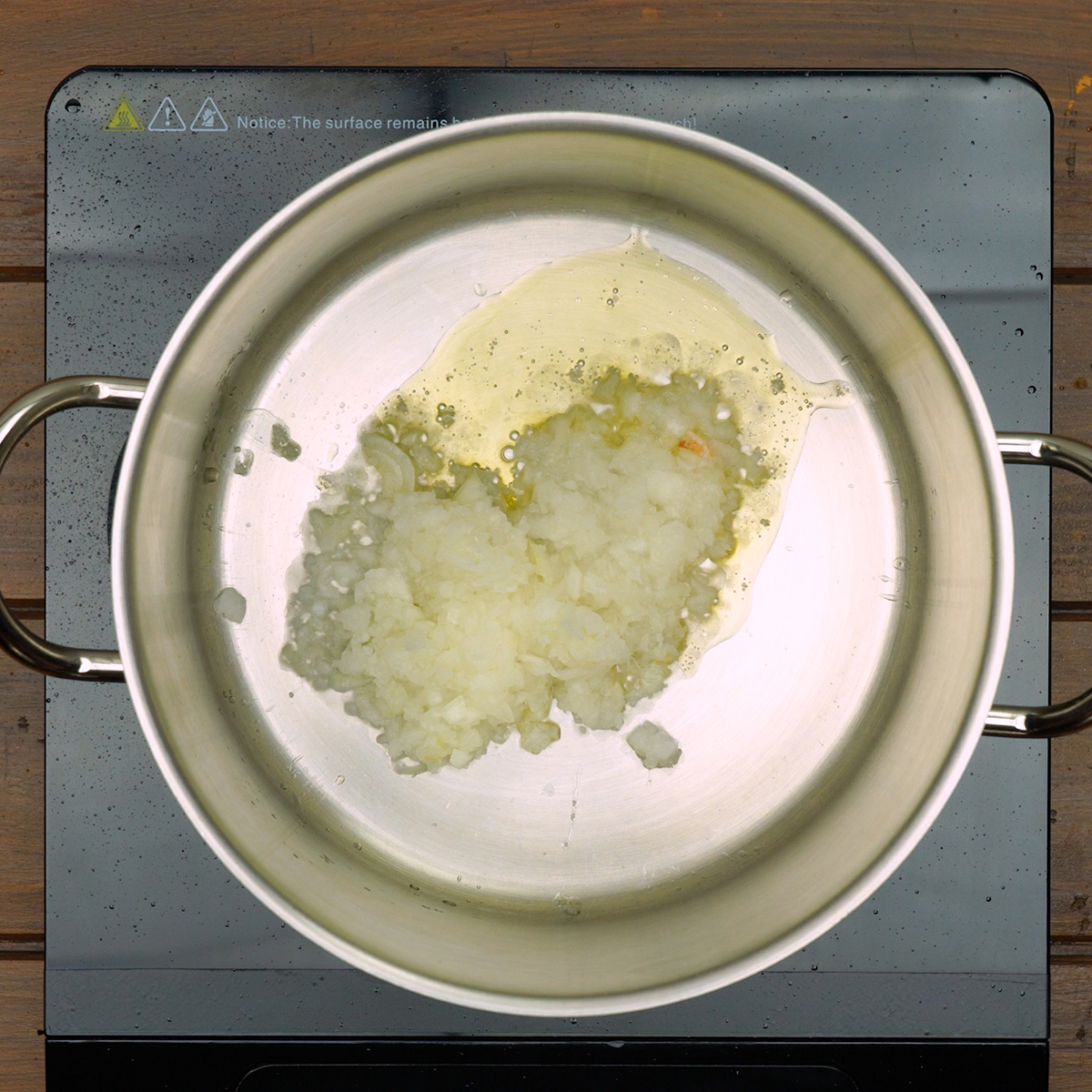 Onion sautéing in olive oil for traditional Caldo Verde soup.