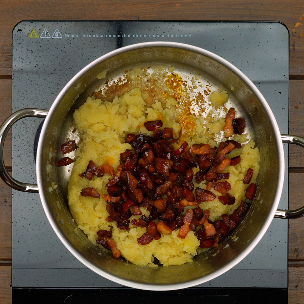 Smoked sausages being added back into the creamy Caldo Verde base.