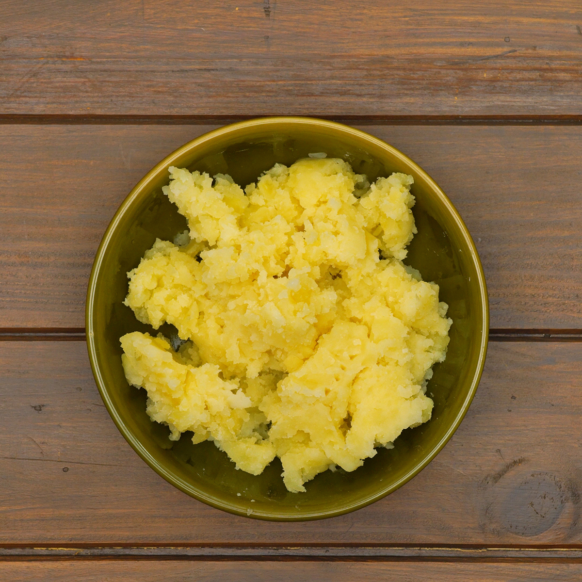 Mashed potatoes prepared for Caldo Verde soup in a pot.