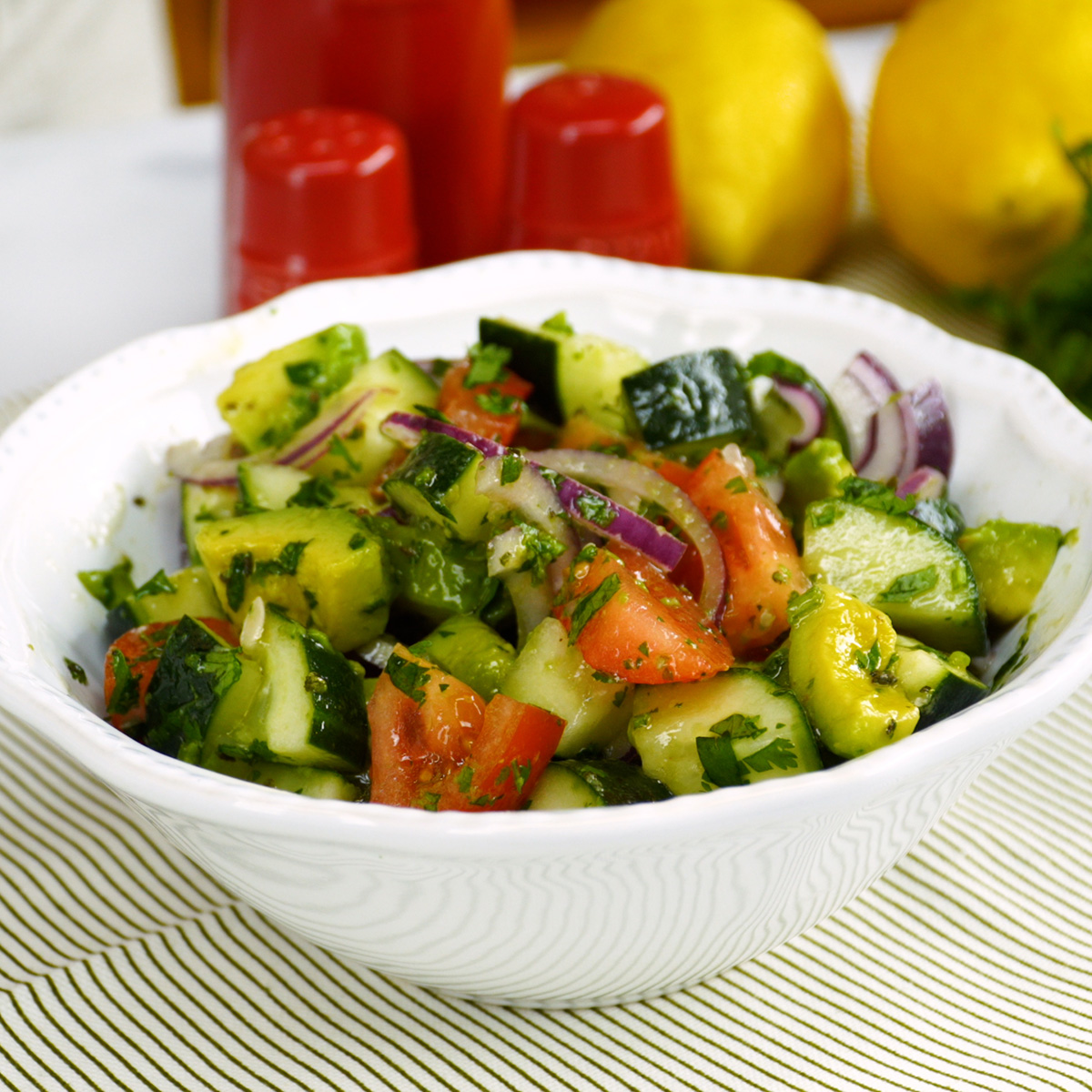 Avocado lemon salad ready to serve in a bowl.