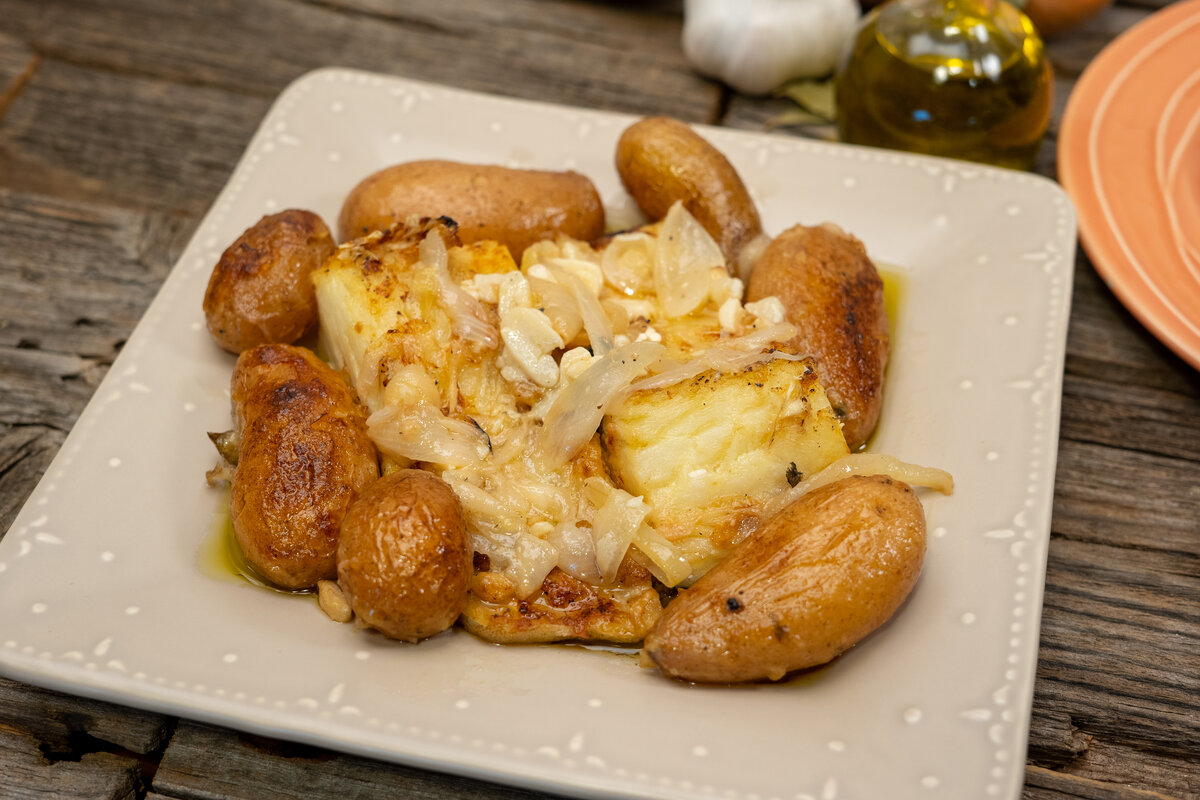 Baked cod with potatoes ready to serve