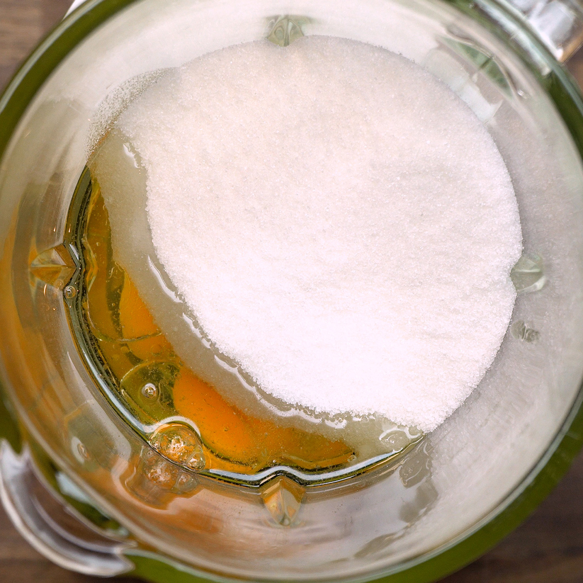 Eggs, oil and sugar being blended for chocolate cake batter.