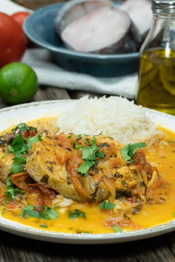 Plated Capixaba-style Brazilian fish stew finished with fresh cilantro.