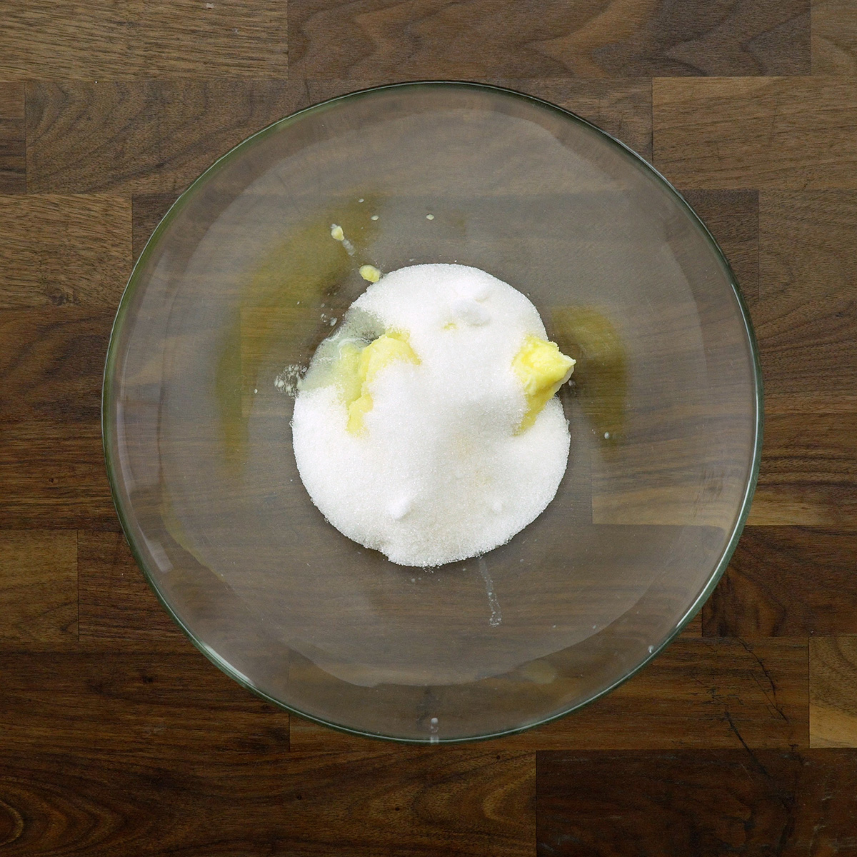 Butter and sugar being beaten until creamy for apple cinnamon cake.