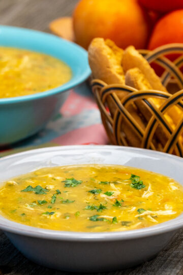Creamy chicken and yuca soup served in a bowl and finished with fresh cilantro.