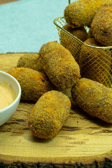 Crispy beef croquettes served with dipping sauce.