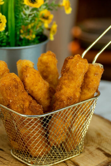 Crispy fried mozzarella sticks ready to serve.