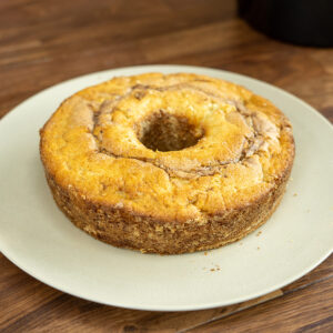 Easy apple cinnamon cake sliced and served on a plate.