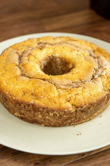 Easy apple cinnamon cake sliced and served on a plate.
