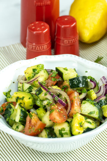 Avocado lemon salad ready to serve in a bowl.