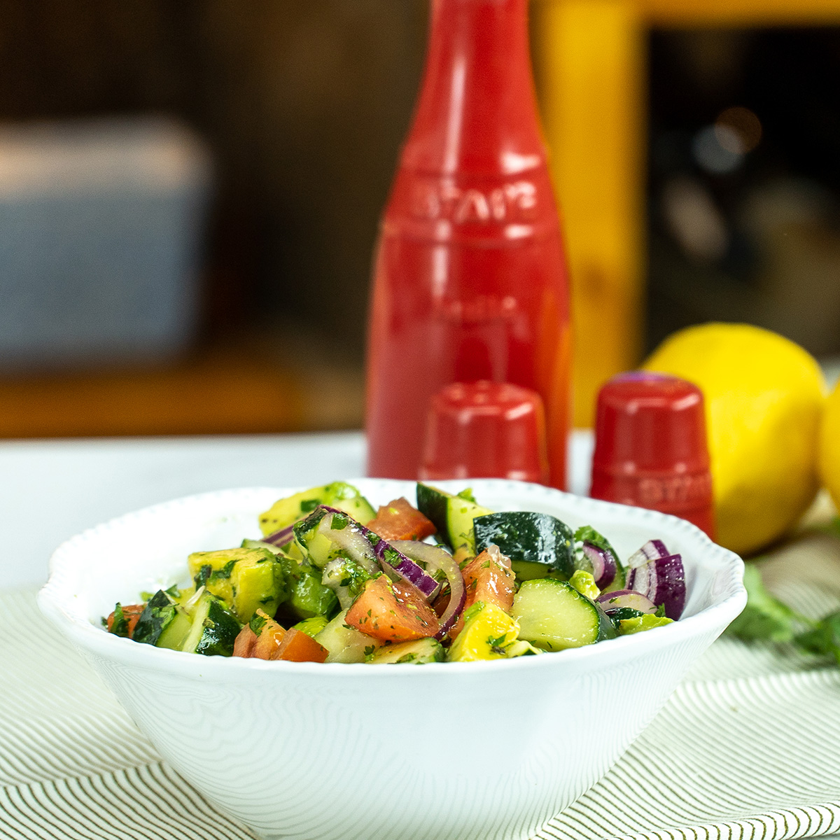 Avocado lemon salad ready to serve in a bowl.