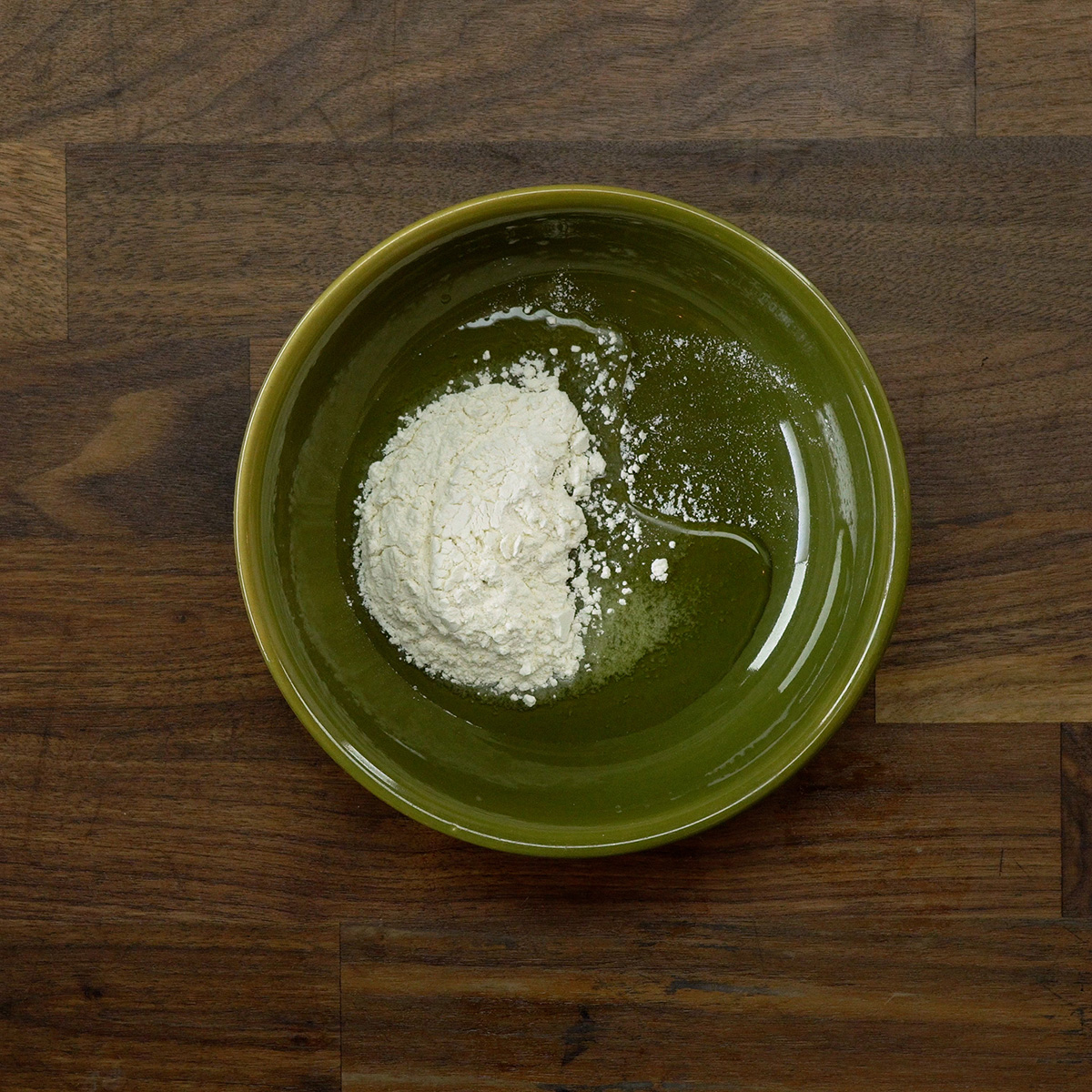 Homemade cake pan release made with butter, oil, and flour in a bowl.