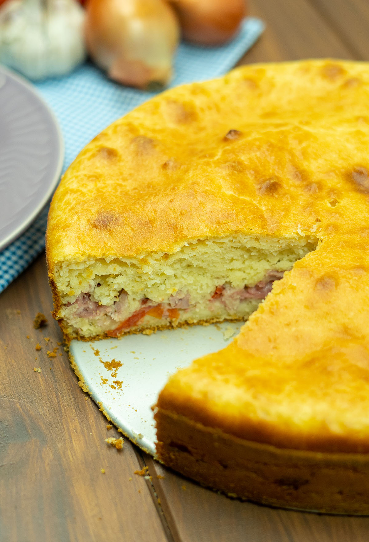 Savory mortadella and cheese pie served in slices.