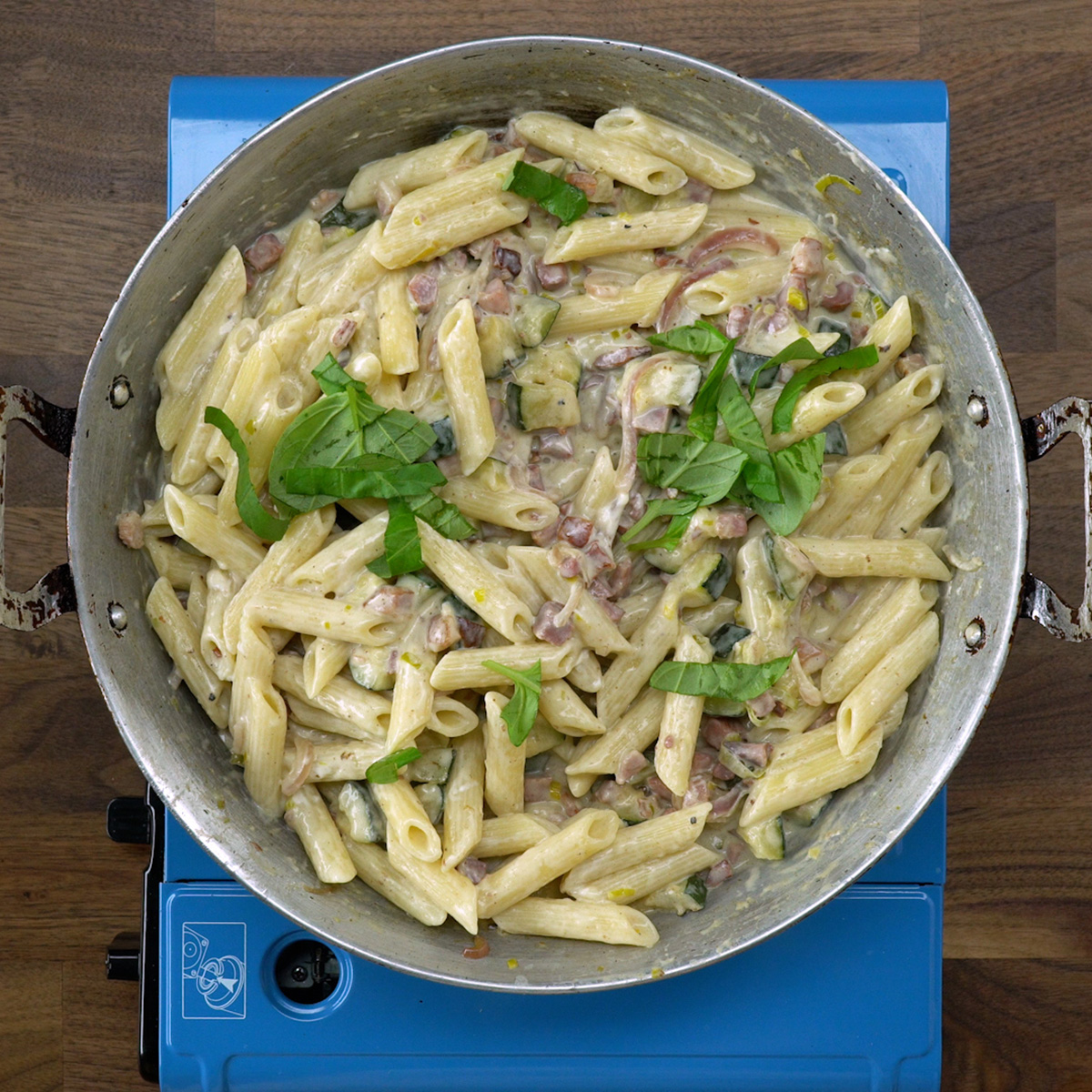 Penne tossed with creamy sauce, bacon, zucchini and basil.