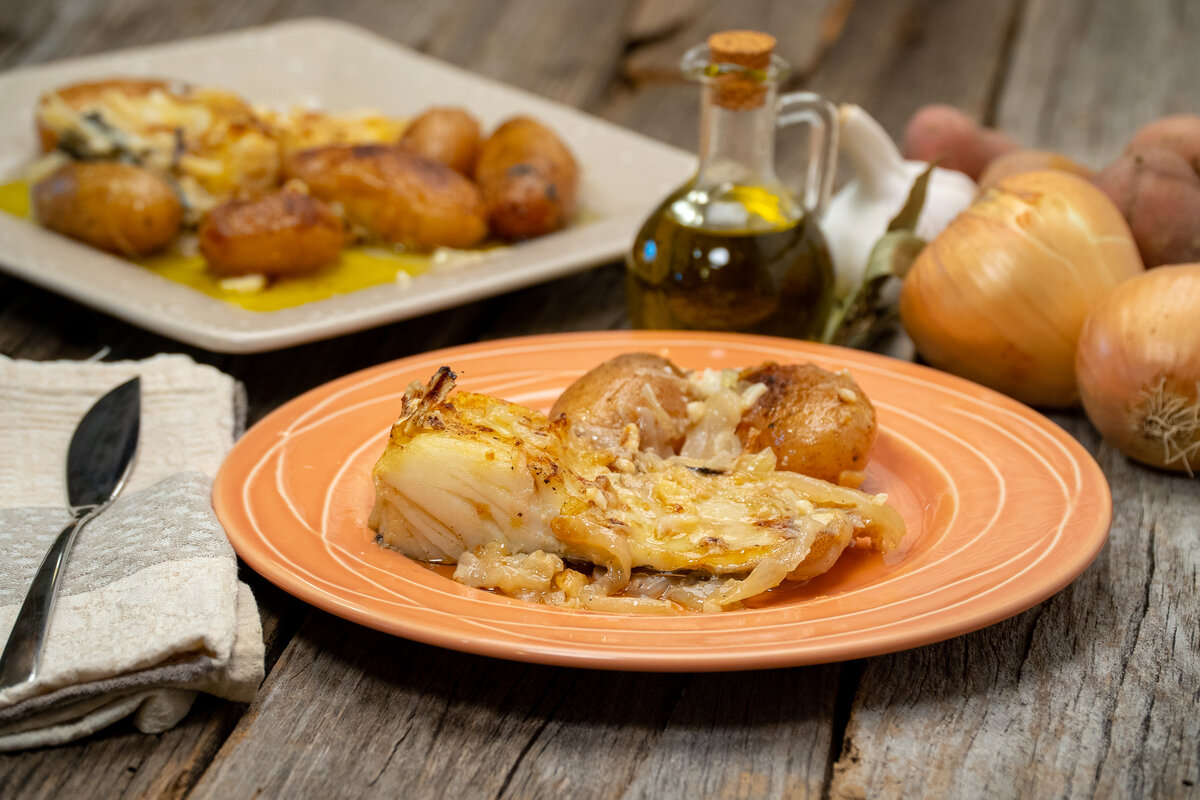 Portuguese baked cod and potatoes served warm
