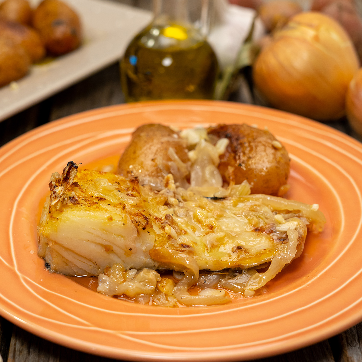 Plate of Portuguese baked cod with potatoes
