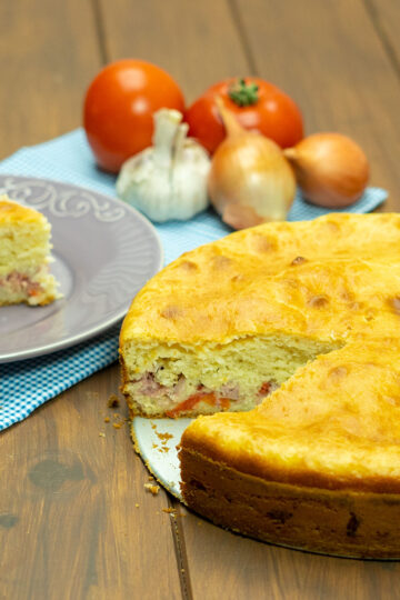 Slice of savory mortadella and cheese blender pie being served.