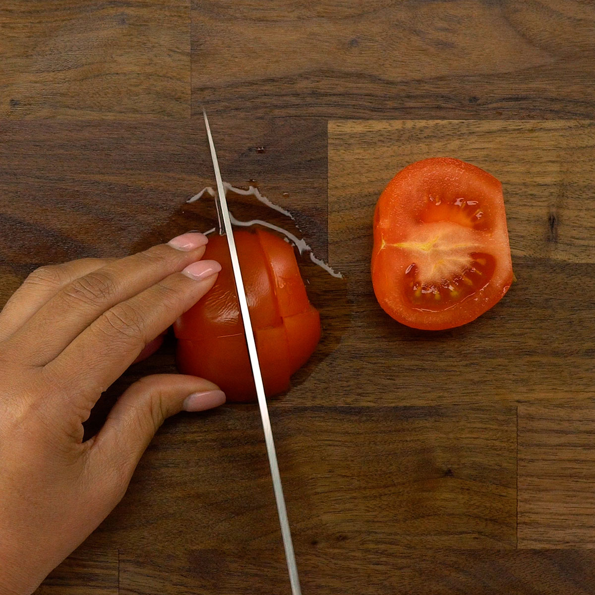 Tomato sliced into half moon pieces.
