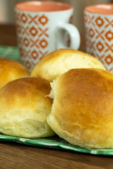Soft homemade potato rolls being served.